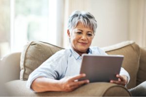 woman reading email on ipad