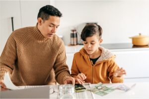 financial education dad showing kid