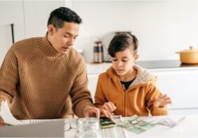 financial education dad showing kid